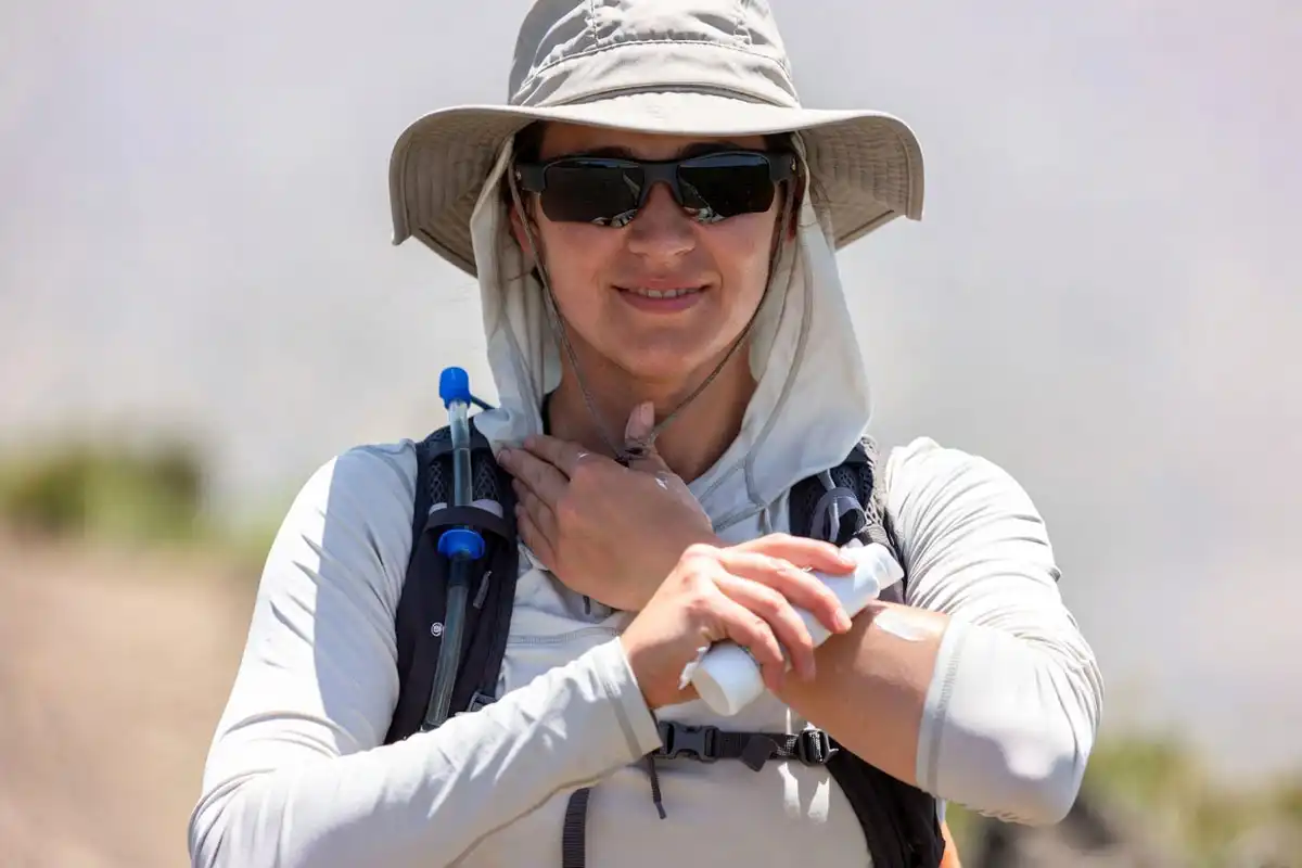 sun hoodie hat and sunscreen for trail protection