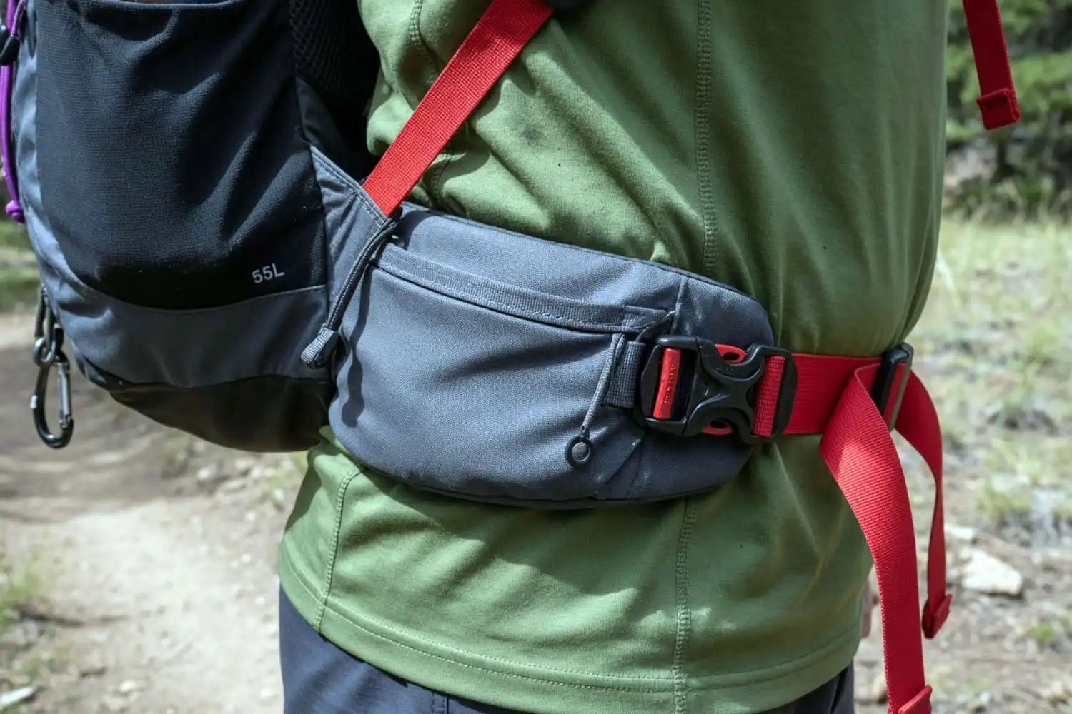 a hiking backpack hip belt correctly positioned on the iliac crest of a hiker