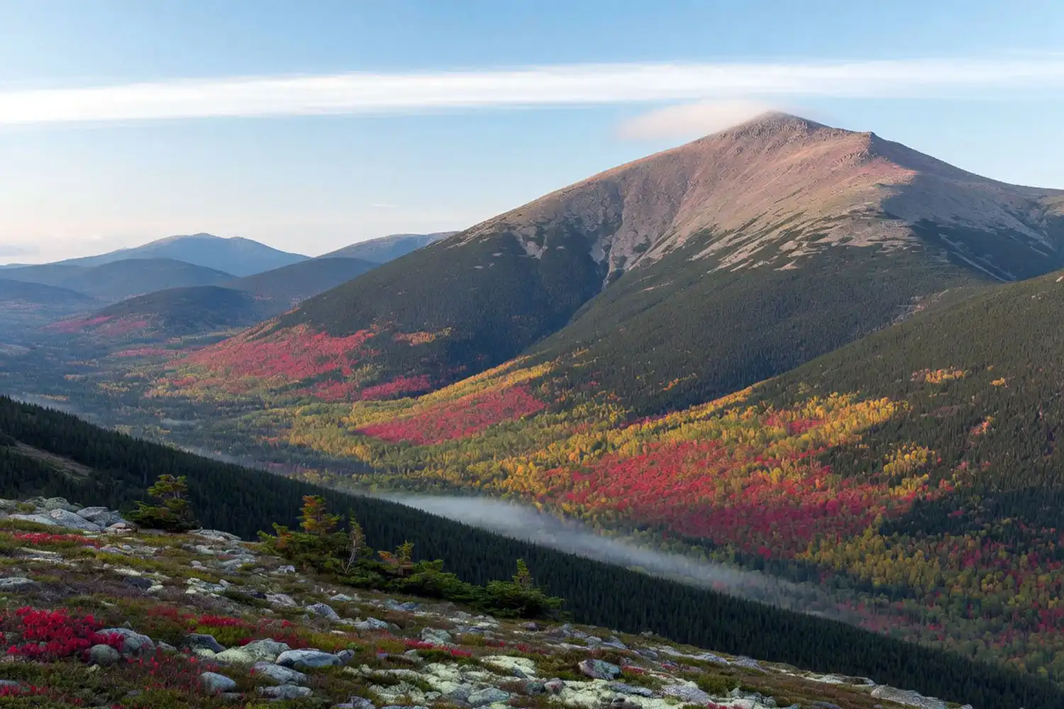 Mount Washington rising above the White Mountain National Forest in early autumn